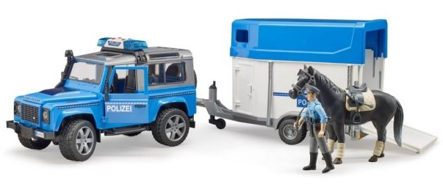 Dřevěné hračky Bruder Policejní Land Rover s přepravníkem na koně a policistou