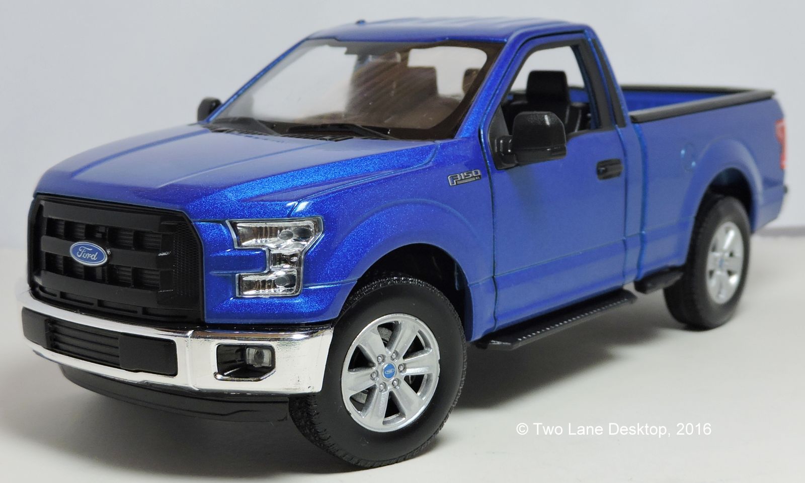 Dřevěné hračky Welly - Ford F-150 Regular Cab (2015) model 1:34 modrý